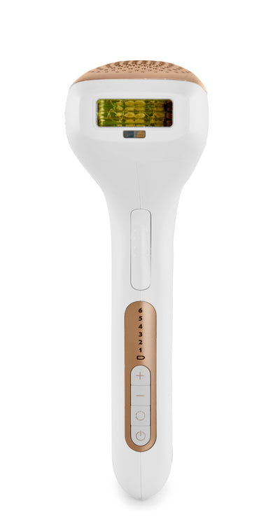 White and gold hair removal device on a white background